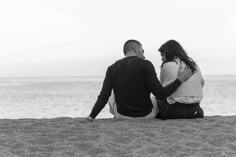 couple talking at the beach