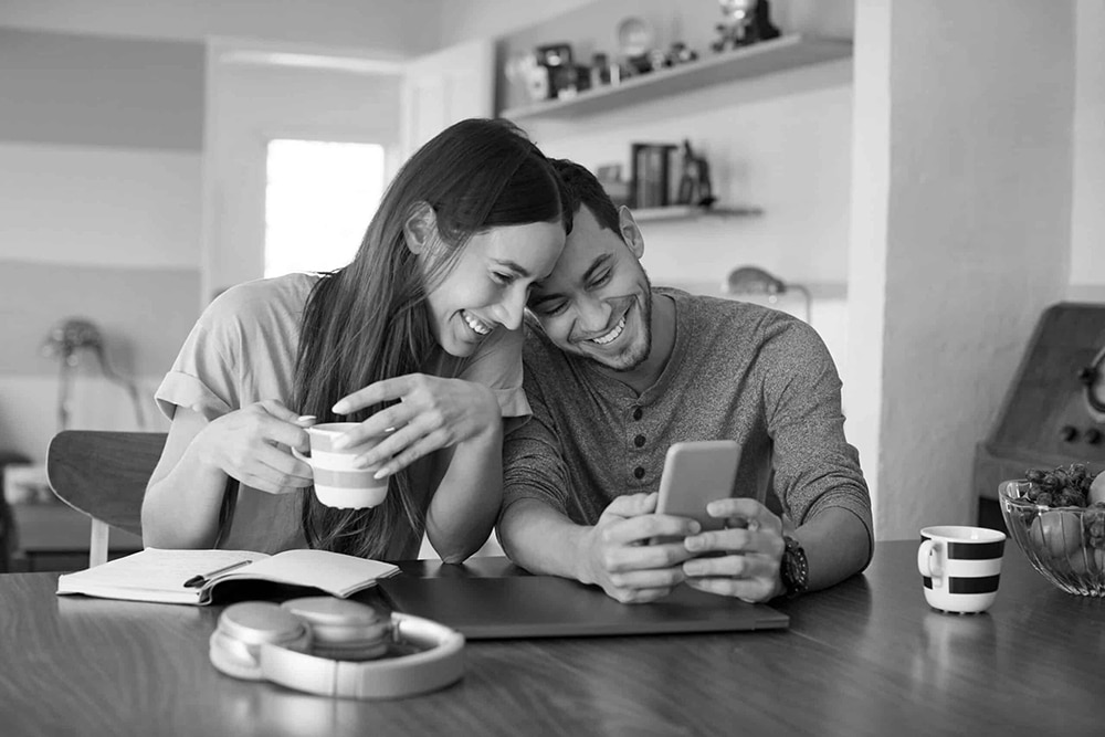 happy couple with phone
