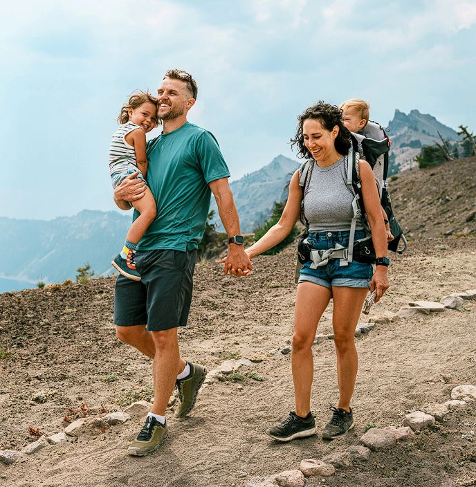 Couple hiking with their kids